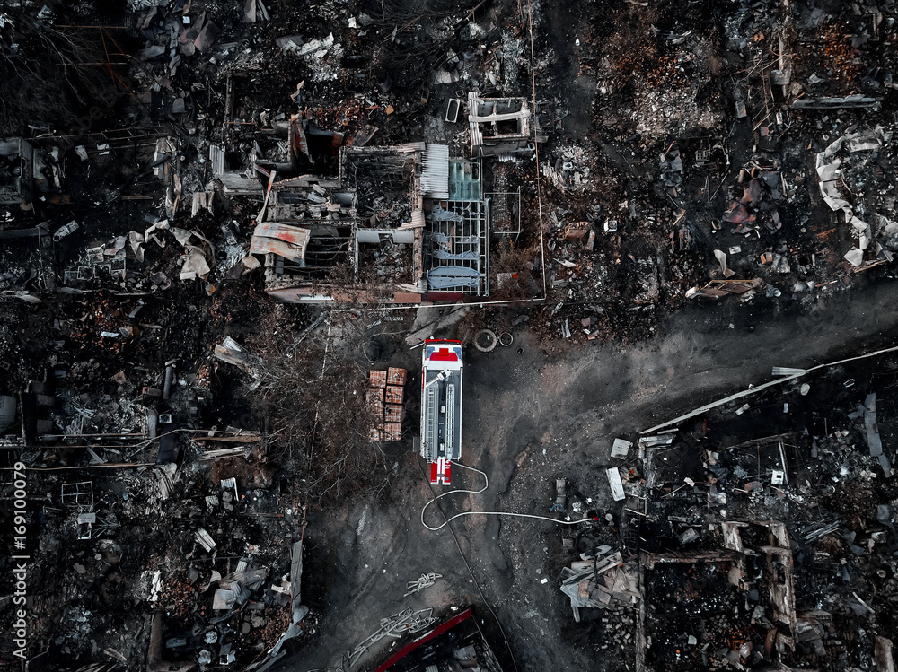 Old home after fire and burned everything in the area. fire truck, top view and Take from drone