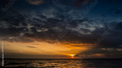Magic sunset view seascape with beautiful colorful sky  sun and clouds