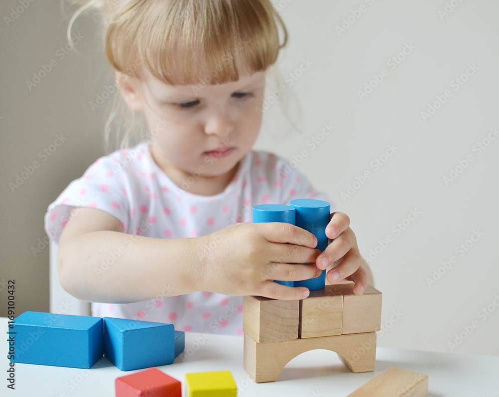 Caucasian Girl Playing with Wooden Colorful Cubes at Home Early Education Preparing for School Development Caucasian Girl Playing with Wooden Colorful Cubes at Home Early Education Preparing for School Development