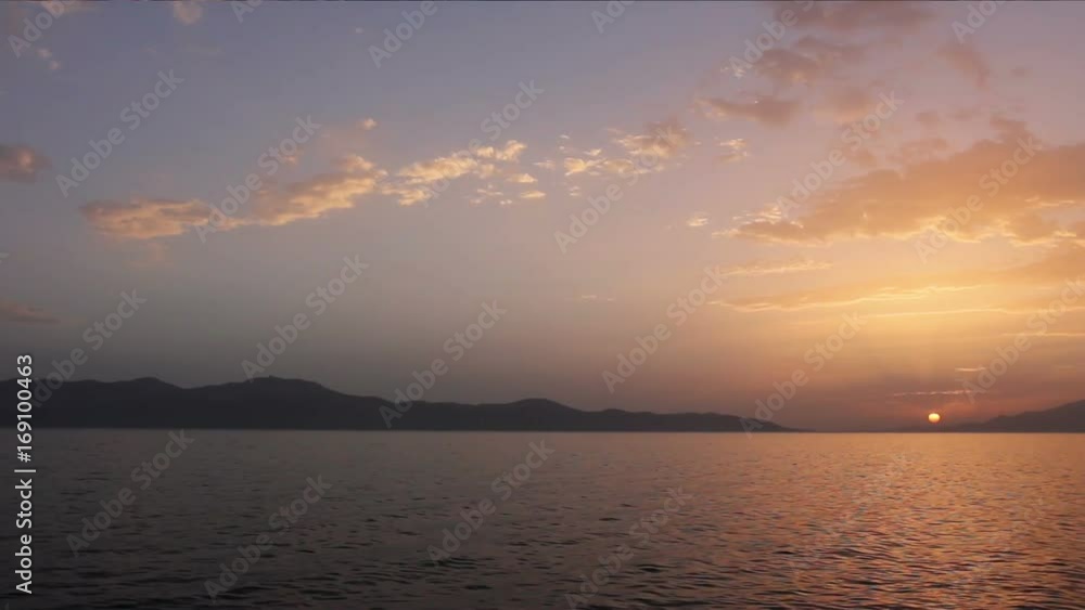 Scenic view of beautiful sunset in the evening time over the sea, water Scenic view of beautiful sunset in the evening time over the sea, water