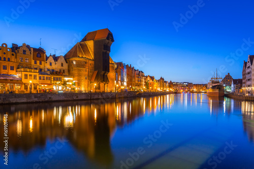 Gdansk at night with historic port crane reflected in Motlawa river, Poland © Patryk Kosmider