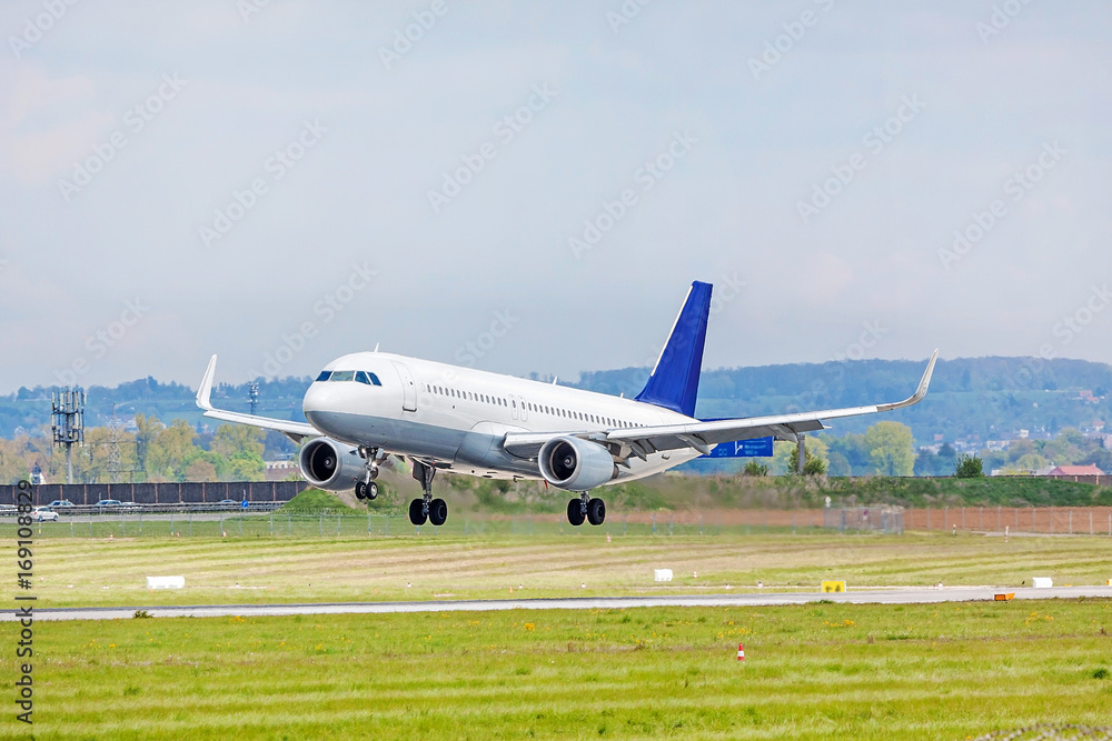 Airplane on landing approach at airport