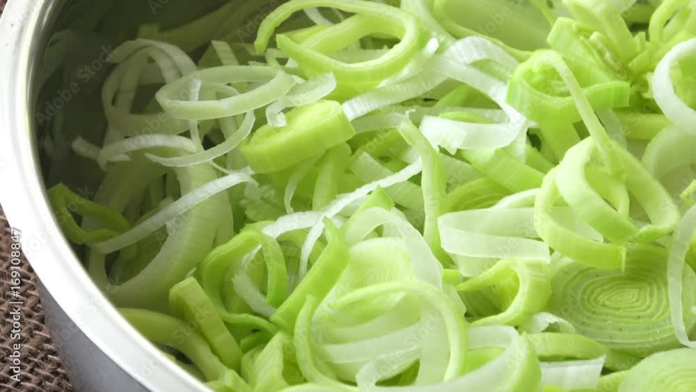 Fresh leek slices in a pan,selective focus. Detail of leek slices.
Fresh leek slices in a pan,selective focus. Detail of leek slices.