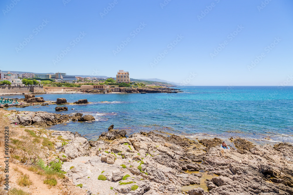 Fototapeta premium Alghero, Sardinia, Italy. Stony bank under the ancient fortress walls