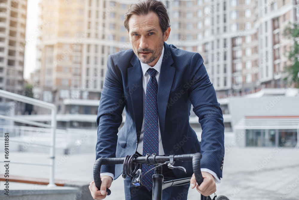 Senior business man with a bicycle outdoors Senior business man with a bicycle outdoors