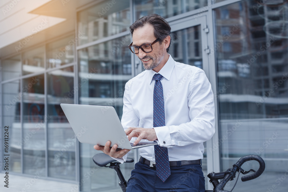 Senior business man with a bicycle outdoors Senior business man with a bicycle outdoors