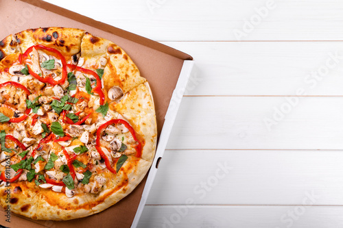 pizza with copy space on white table. top view