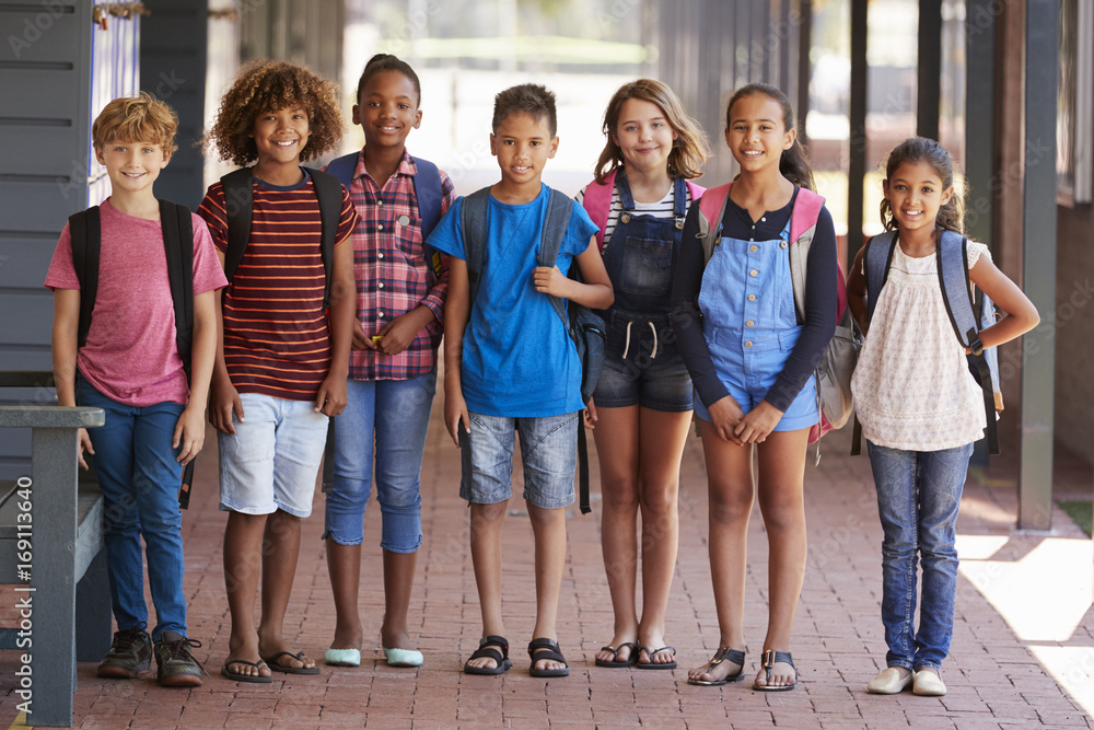 Portrait of kids standing in elementary school hallway Portrait of kids standing in elementary school hallway