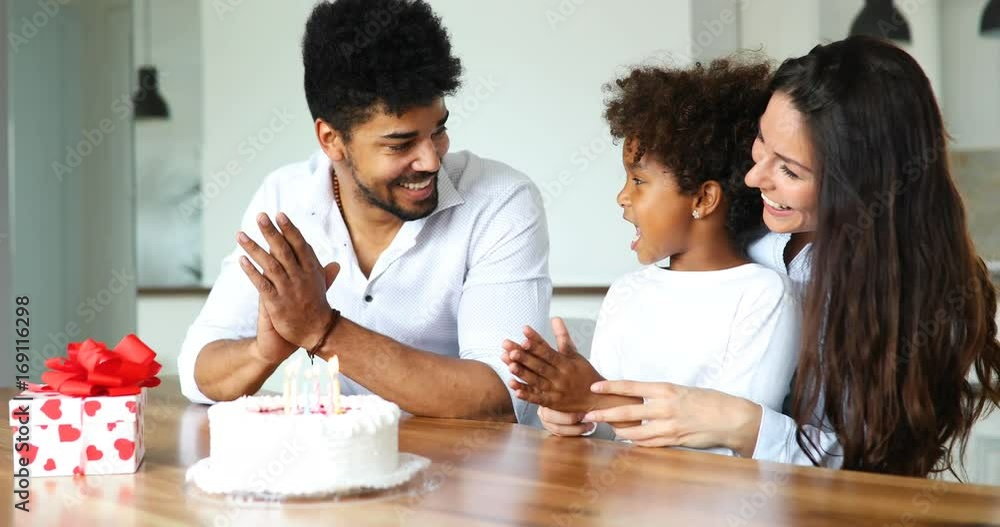 Happy family celebrating birthday of their child Happy family celebrating birthday of their child