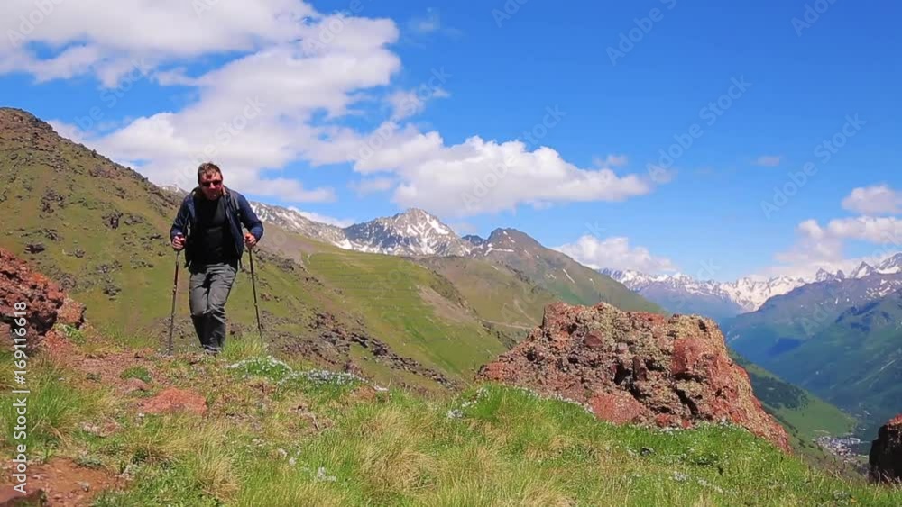 man with Hiking sticks in the mountains man with Hiking sticks in the mountains