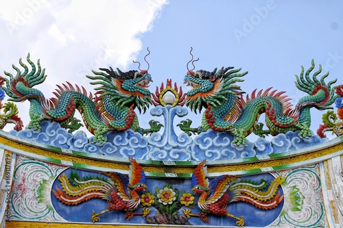 Chinese temple roof top. Decorated. With dragons and birds