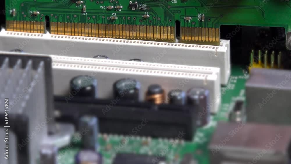 Hand insert pci card into motherboard slot on desktop pc Hand insert pci card into motherboard slot on desktop pc