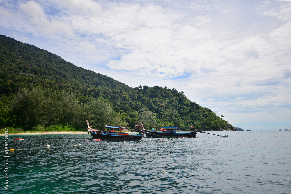 Fototapeta premium Tropical white sand and blue sea with blue sky at Andaman Sea. Lipe Island, Satun, Thailand.