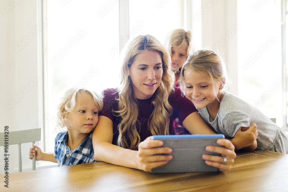 Mother and children using digital tablet Mother and children using digital tablet