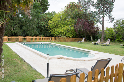 Luxurious swimming pool in backyard of a residential home