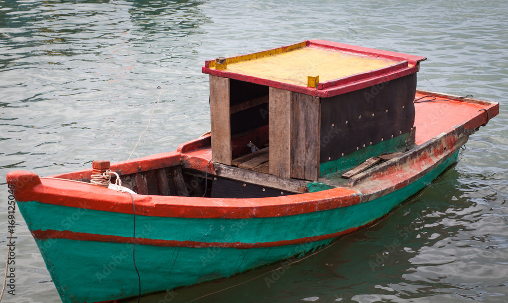 traditional colorful Vietnamese fishing boats in Ben Ngu wharf of Nam Du Islands, Kien Giang, Vietnam. Nam Du has become a popular tourist attraction, but foreigner are only allowed in with a permit. traditional colorful Vietnamese fishing boats in Ben Ngu wharf of Nam Du Islands, Kien Giang, Vietnam. Nam Du has become a popular tourist attraction, but foreigner are only allowed in with a permit.