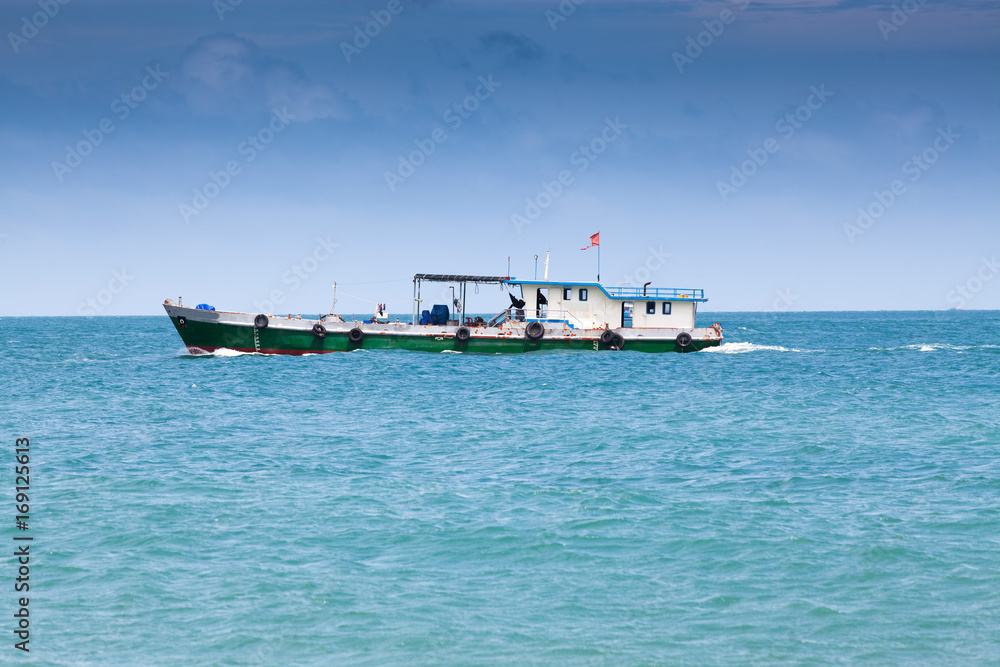 traditional colorful Vietnamese fishing boats in Ben Ngu wharf of Nam Du Islands, Kien Giang, Vietnam. Nam Du has become a popular tourist attraction, but foreigner are only allowed in with a permit. traditional colorful Vietnamese fishing boats in Ben Ngu wharf of Nam Du Islands, Kien Giang, Vietnam. Nam Du has become a popular tourist attraction, but foreigner are only allowed in with a permit.