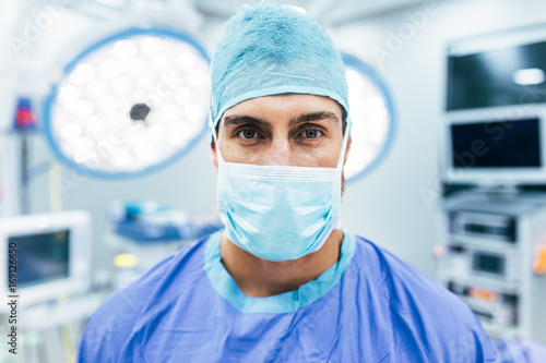 Surgeon wearing surgical mask and scrubs in operation theater