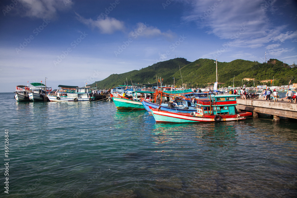 traditional colorful Vietnamese fishing boats in Ben Ngu wharf of Nam Du Islands, Kien Giang, Vietnam. Nam Du has become a popular tourist attraction, but foreigner are only allowed in with a permit.