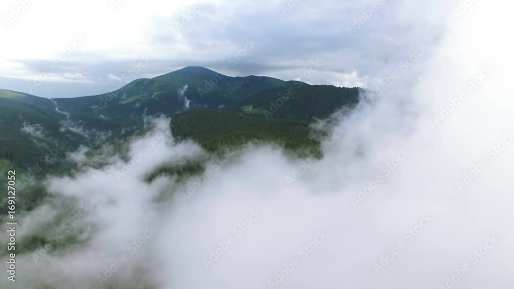 4K .Aerial. Beautiful flight in mountains among clouds. Real shoot
