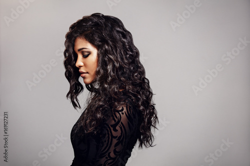 Attractive young woman with curly hair