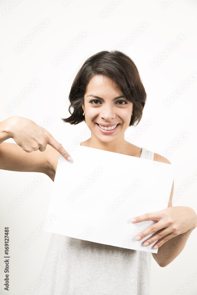 Beautiful young woman holding a blank sheet of paper Beautiful young woman holding a blank sheet of paper