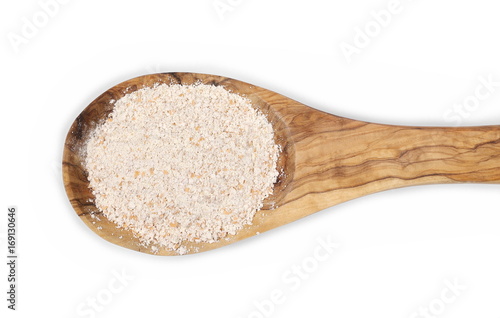 Bilde på lerret Pile of integral spelt wheat flour in wooden spoon isolated on white