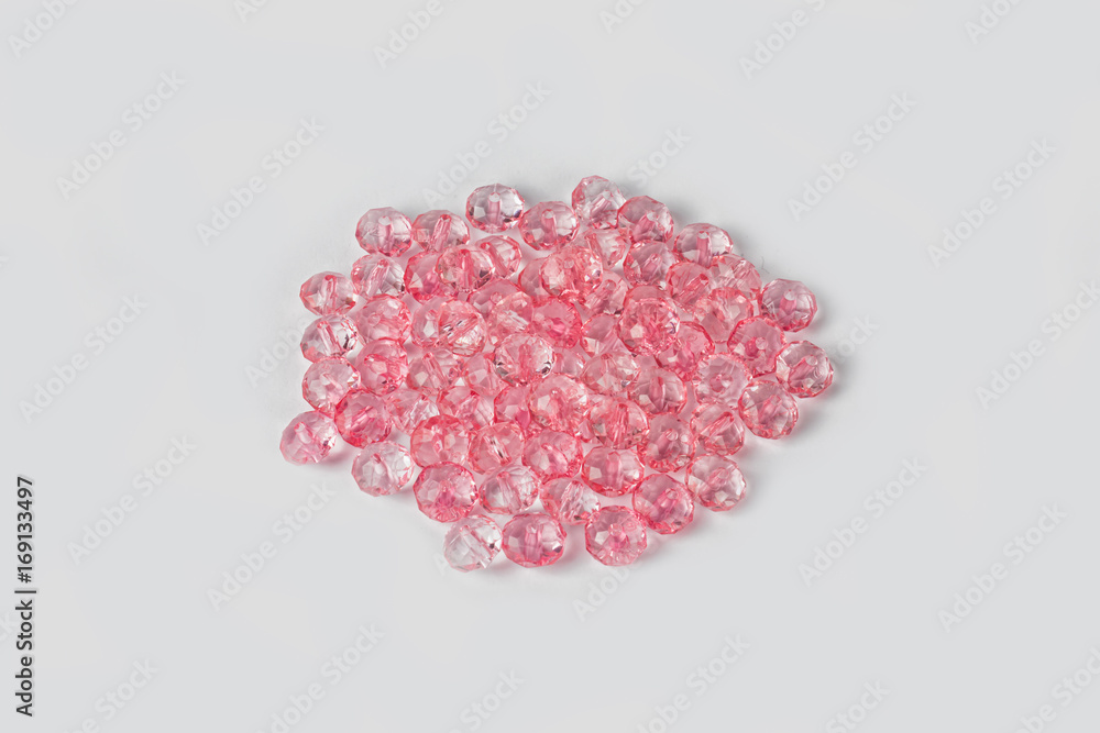 Pink acrylic beads on a white background Pink acrylic beads on a white background