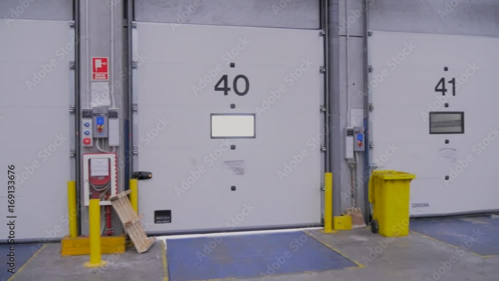 Loading docks for trucks in logistics warehouse Loading docks for trucks in logistics warehouse