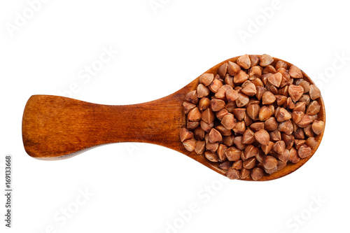 Buckwheat in a wooden spoon on a white background