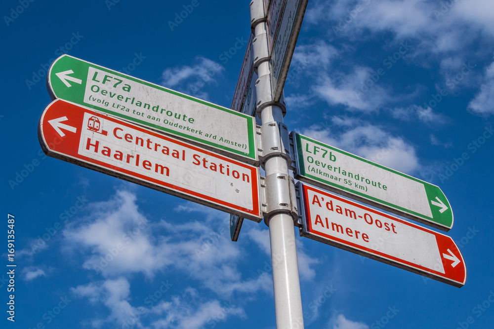 Fototapeta premium Direction signs in Amsterdam on a sunny day