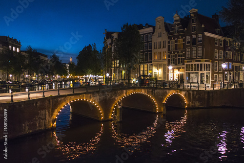 The canals of Amsterdam - illuminated by night