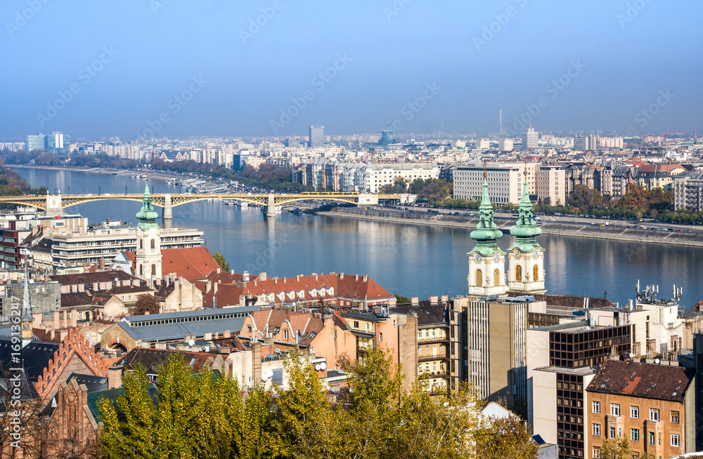 European landmarks. Panoramic view of Budapest with bell towers of the St. Anne's Church and Parliament , Hungary