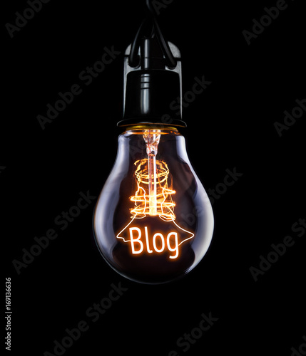 Hanging lightbulb with glowing Blog concept. photo