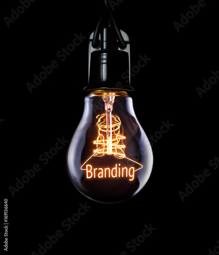 Hanging lightbulb with glowing Branding concept. photo