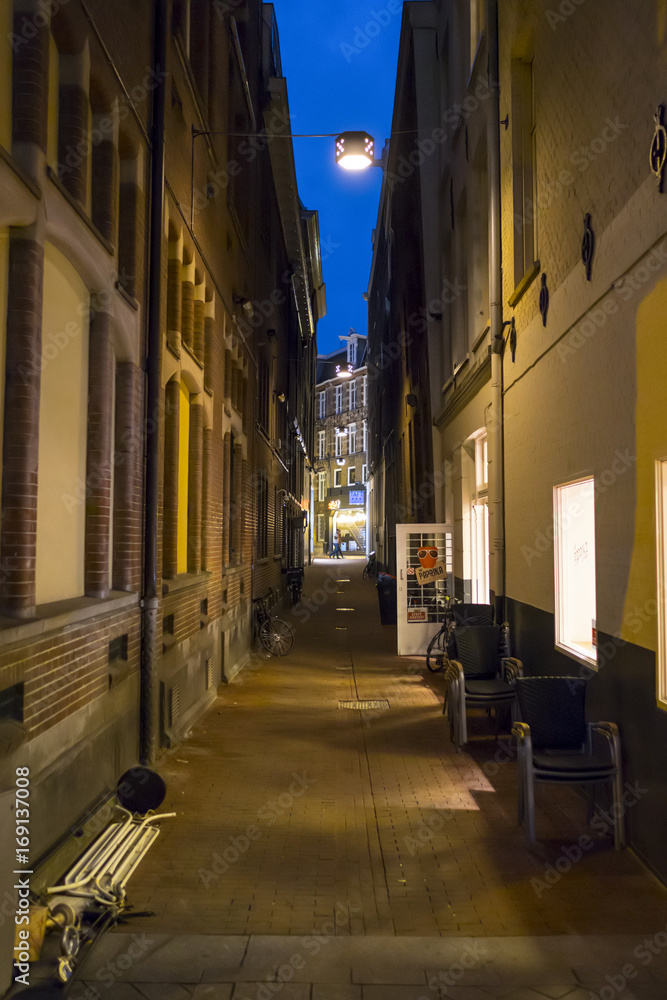 A narrow lane in Amsterdam - evening view - AMSTERDAM - THE NETHERLANDS - JULY 20, 2017