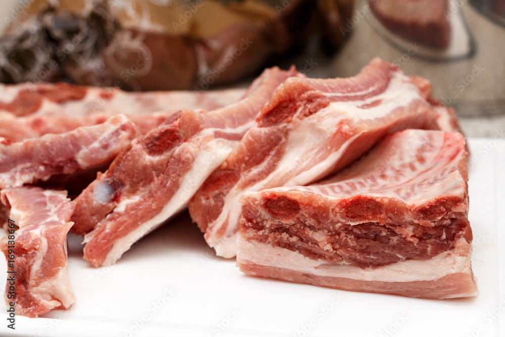 Piece of fresh raw meat ribbon ribs before baking Piece of fresh raw meat ribbon ribs before baking