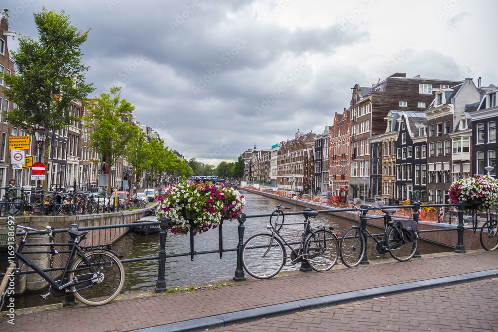 The amazing canals in the city center of Amsterdam - very romantic - AMSTERDAM - THE NETHERLANDS - JULY 20, 2017