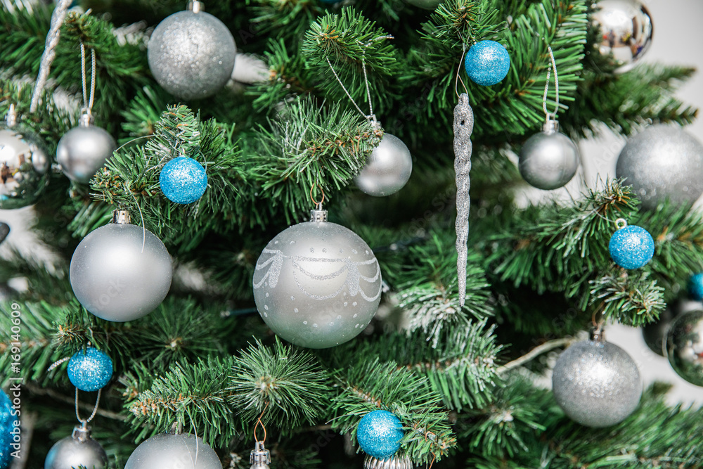 Beautiful christmas tree with blue and white ballson a white background, detaIL Beautiful christmas tree with blue and white ballson a white background, detaIL