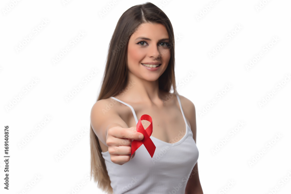 Healthcare and medicine concept - woman holding red AIDS HIV awareness ribbon Healthcare and medicine concept - woman holding red AIDS HIV awareness ribbon