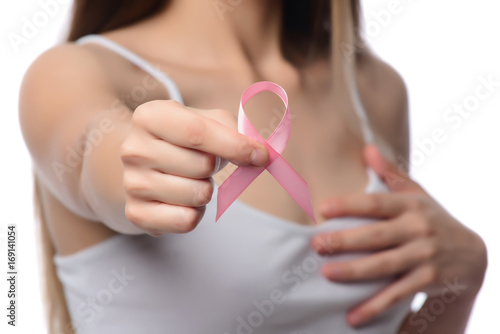 healthcare and medicine concept. Woman hand holding pink breast cancer awareness ribbon.