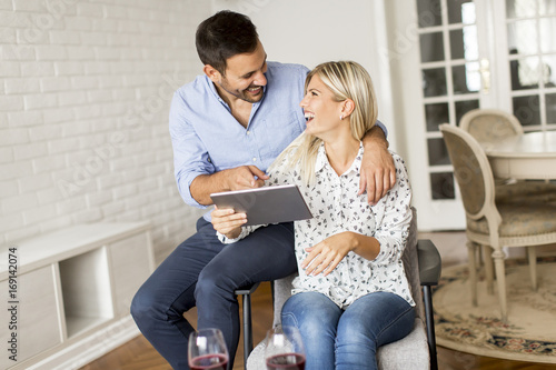 Young couple with tablet in...