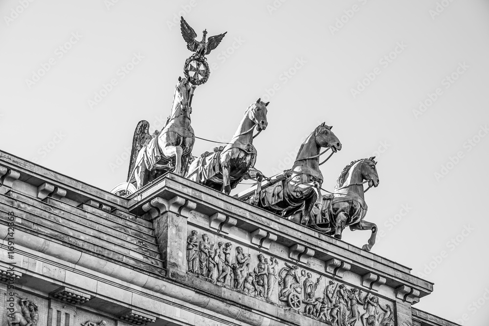 Obraz premium Quadriga statue on famous Brandenburg gate in Berlin - Brandenburger Tor