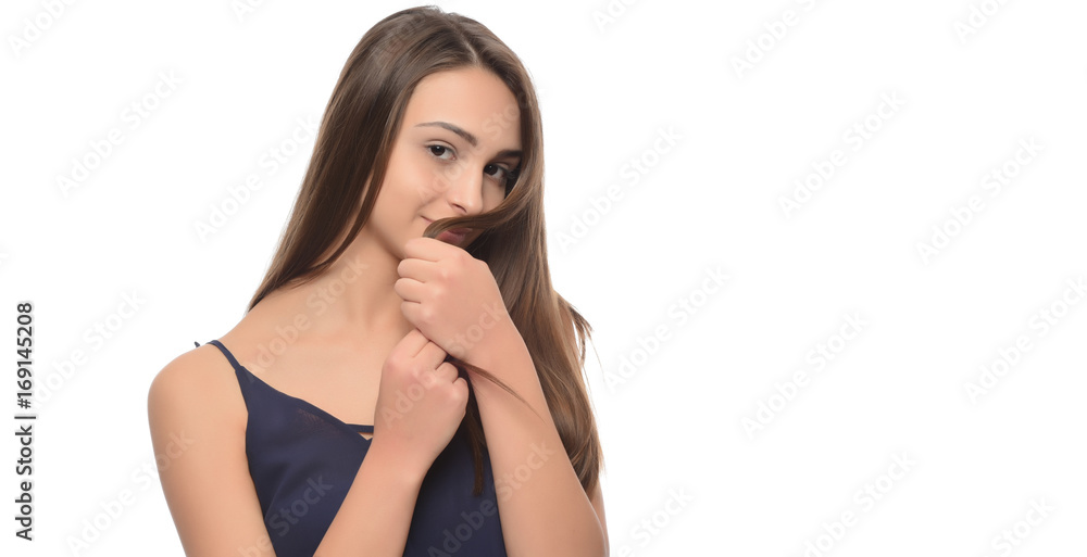 A young beautiful woman touching her hair. isolated