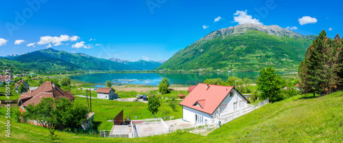 The picturesque Lake Plav in the snow-capped mountains of Montenegro. photo