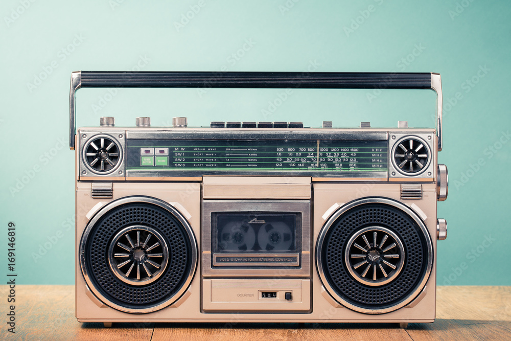 Retro outdated cassette tape recorder from 80s on table front mint green  background. Vintage old style filtered photo Photos | Adobe Stock