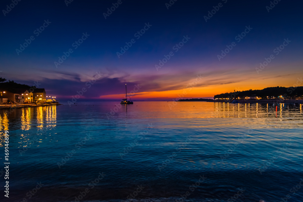 Primosten sunset adriatic sea. / Night sunset view at Primosten beach in Croatia, Europe. Primosten sunset adriatic sea. / Night sunset view at Primosten beach in Croatia, Europe.