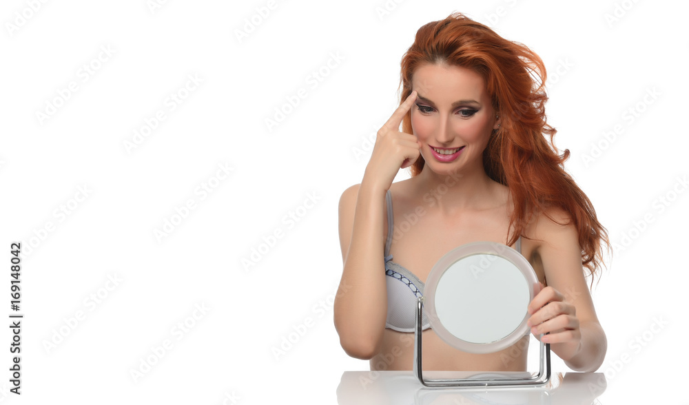 portrait of a beautiful young woman with elegant long red shiny hair looking in the mirror , hairstyle portrait of a beautiful young woman with elegant long red shiny hair looking in the mirror , hairstyle