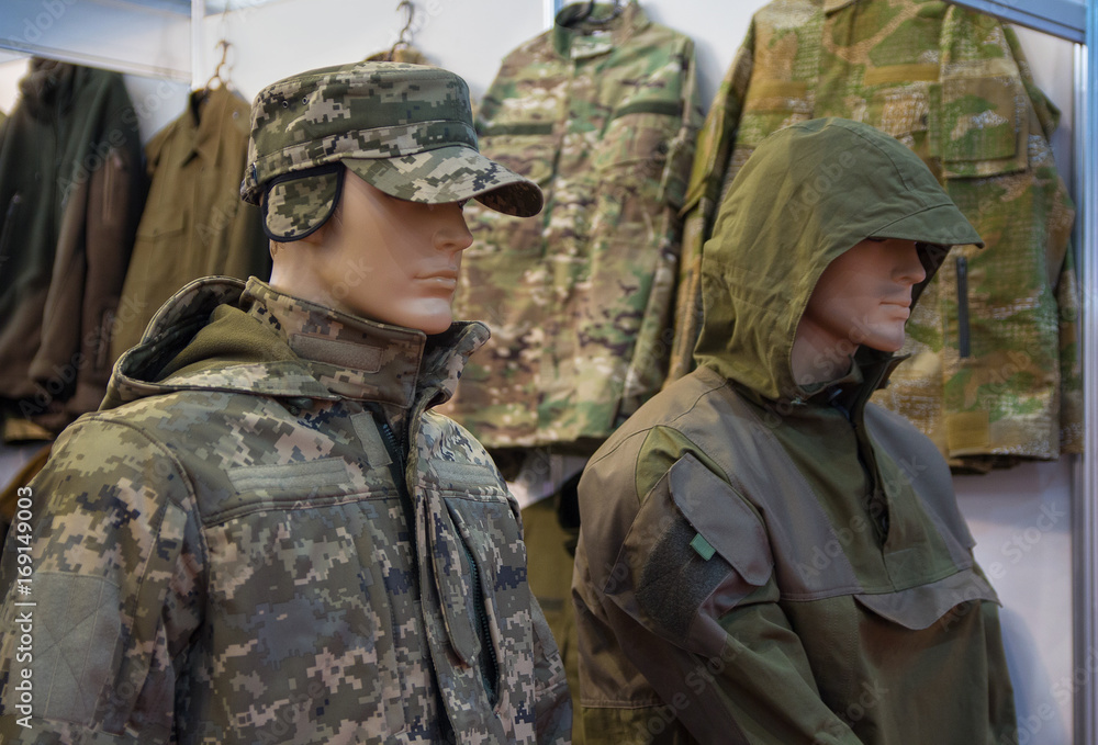 Mannequins in a camouflage military uniform in a store