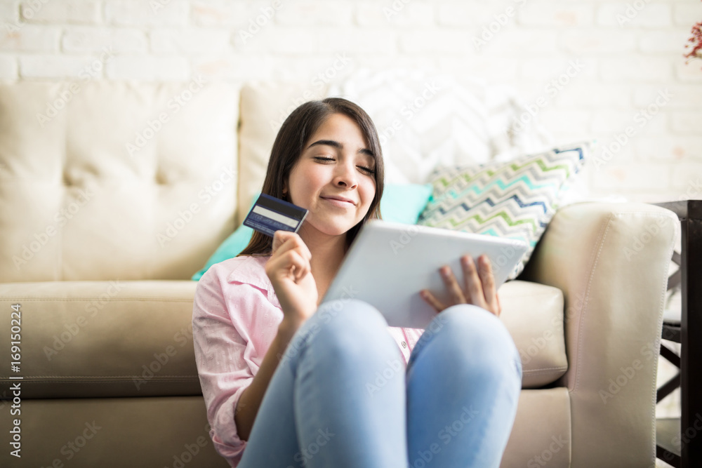 Cute woman having fun shopping online Cute woman having fun shopping online